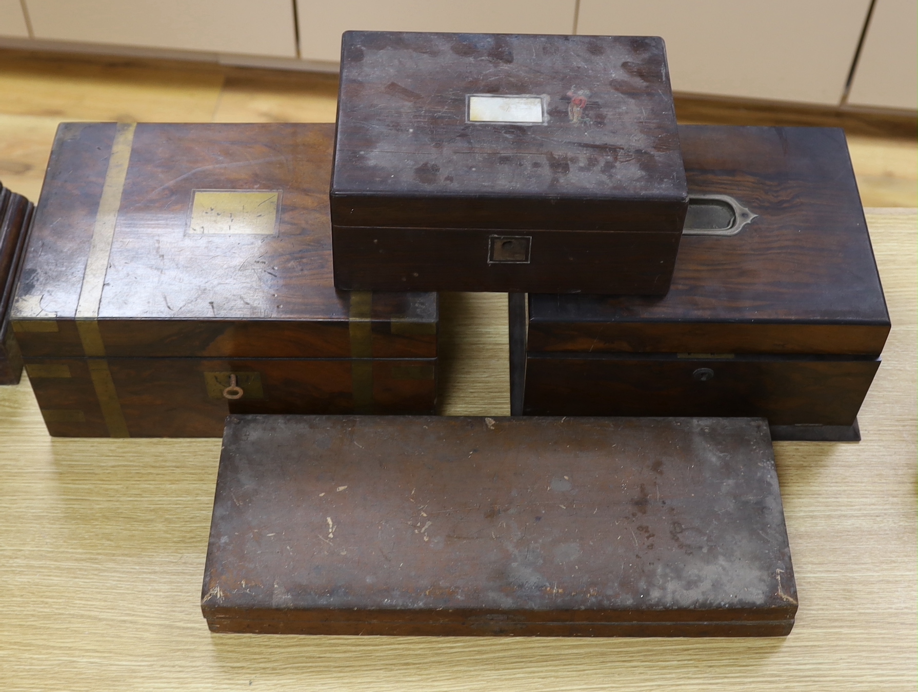 A Victorian brass mounted walnut writing box, work box with fitted interior, rosewood box with mother of pearl inlaid panel together with vintage cased printing blocks, the largest 47.5cm wide